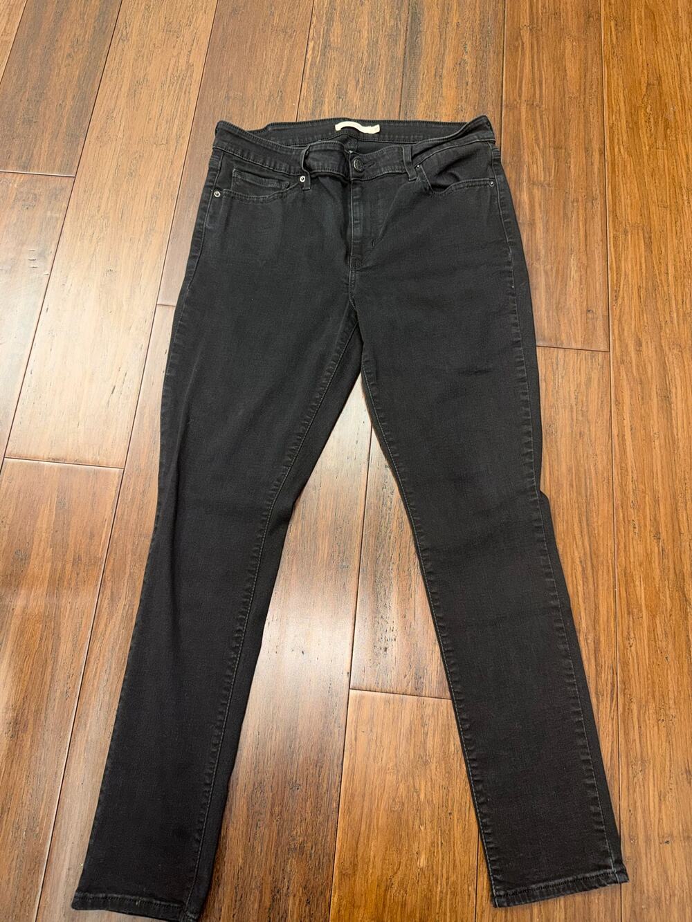 pair of  711 Levi's Women's Mid-Rise Skinny Jeans. 31